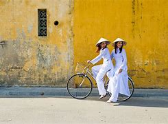 The picture of 2 girls in traditional dress Ao dai